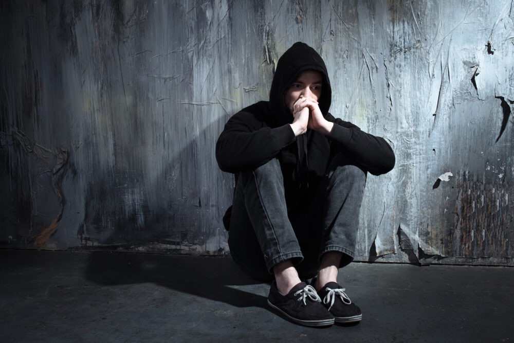 Frustrated man in a black hoodie